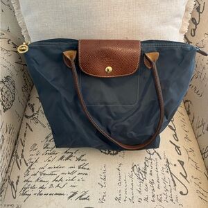 Longchamp shoulder bag, small/medium sized, dark navy color, brown straps